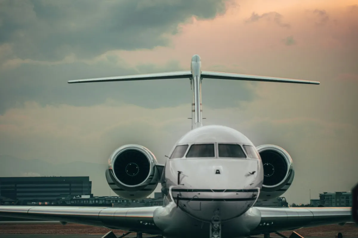 Business jet facing the camera on the ramp at dusk