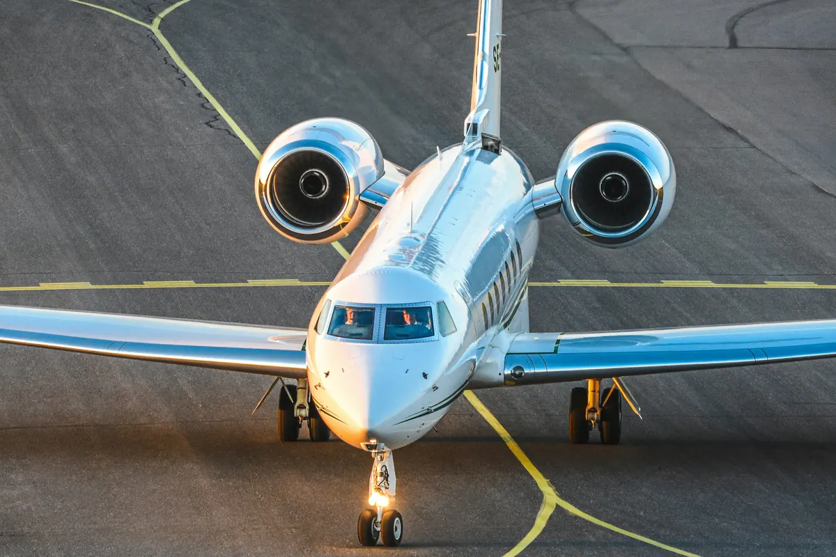 Long-range jet taxiing toward the camera