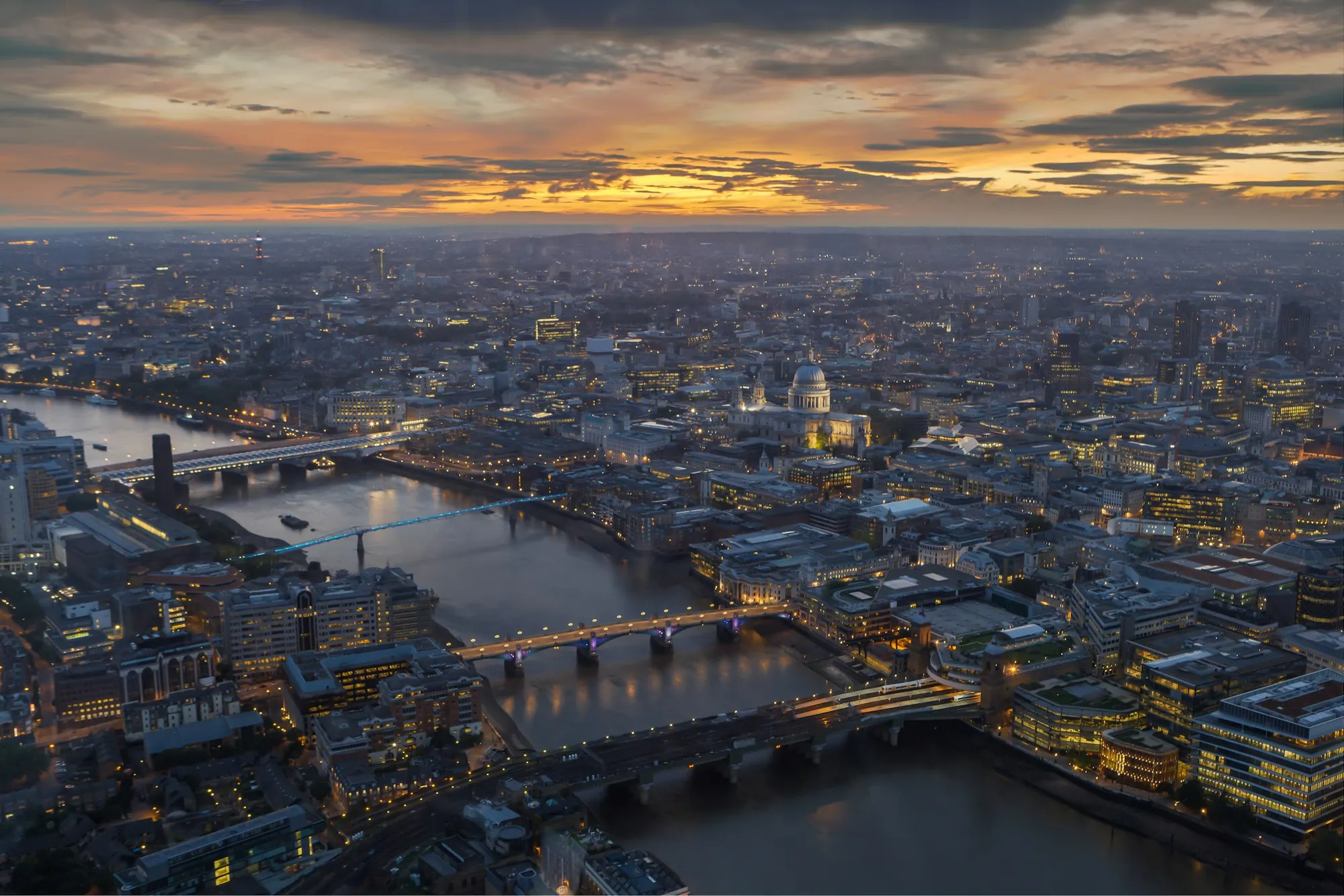 The Thames and London’s bridges from the air at dusk